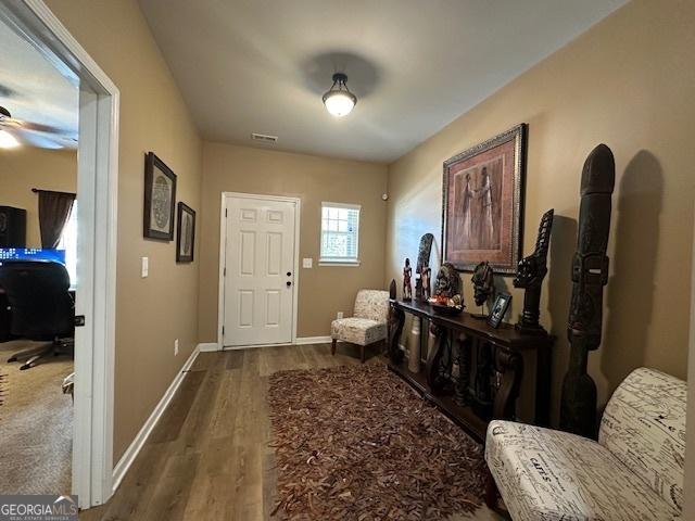 foyer entrance featuring hardwood / wood-style floors and ceiling fan