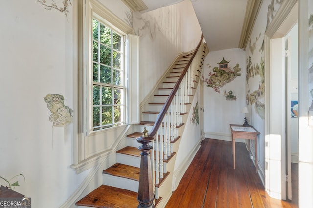 staircase with hardwood / wood-style flooring