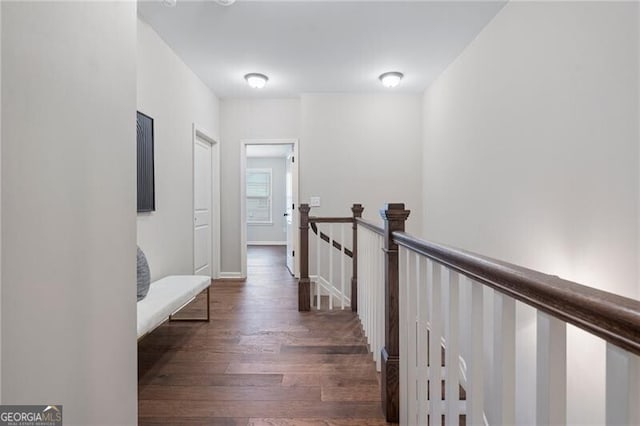 hallway with dark wood-type flooring