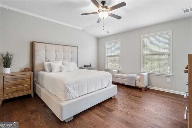 bedroom with ceiling fan, dark hardwood / wood-style flooring, lofted ceiling, and crown molding