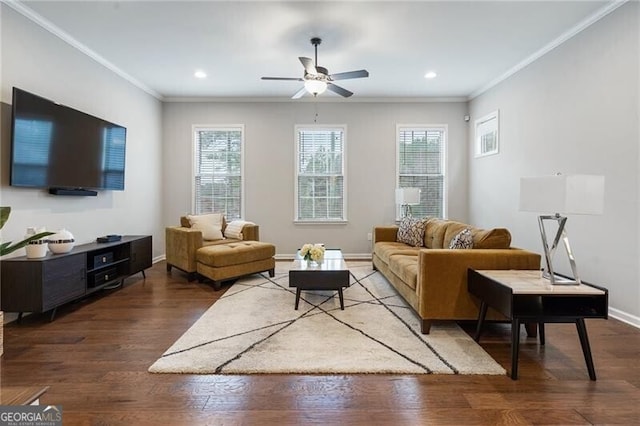 living room with hardwood / wood-style flooring, ceiling fan, and crown molding