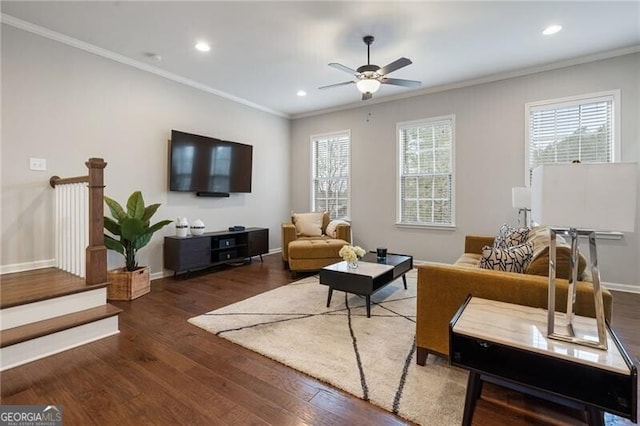 living room featuring crown molding, plenty of natural light, and dark wood-type flooring