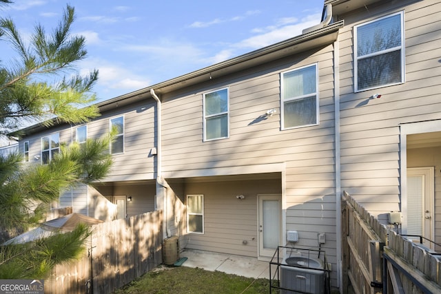 back of property with central AC unit