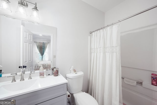 full bathroom featuring vanity, toilet, and shower / tub combo with curtain