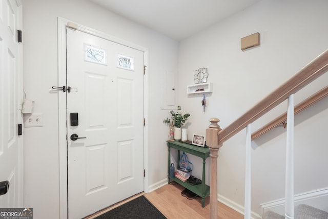 entrance foyer featuring electric panel and light hardwood / wood-style floors