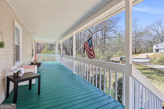 wooden terrace featuring a porch