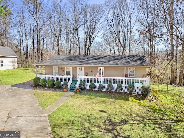 view of front facade with covered porch and a front yard