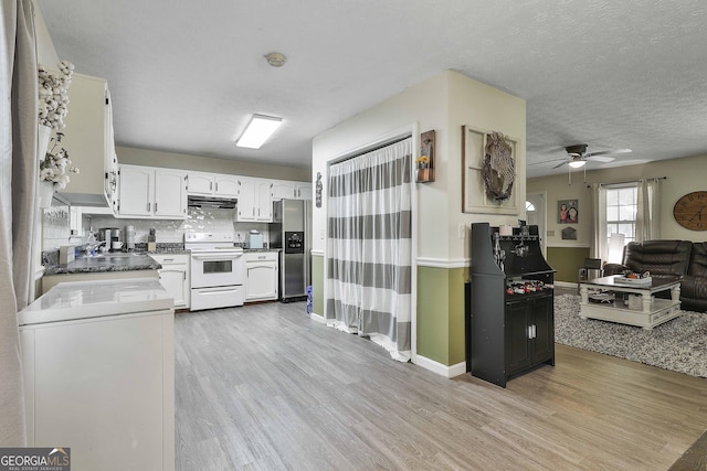 kitchen with light wood-style floors, stainless steel refrigerator with ice dispenser, white electric range oven, and under cabinet range hood