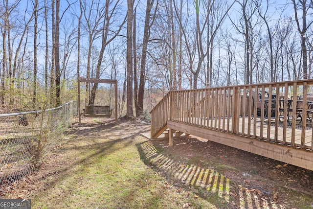 view of yard with fence and a deck