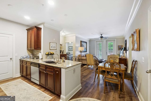 kitchen featuring sink, stainless steel dishwasher, dark hardwood / wood-style floors, tasteful backsplash, and kitchen peninsula