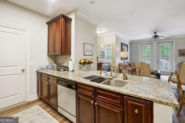 kitchen featuring kitchen peninsula, ceiling fan, sink, dishwasher, and light hardwood / wood-style floors