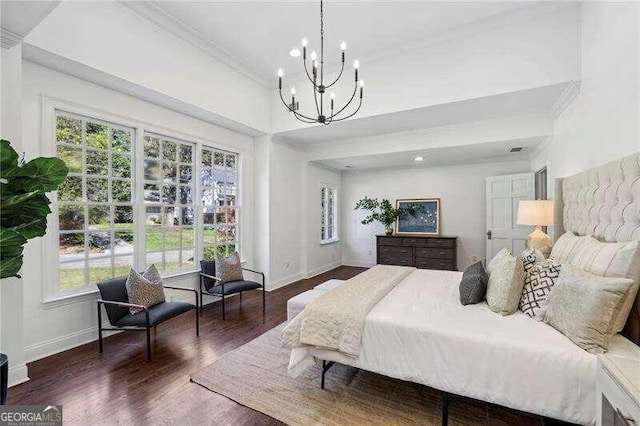 bedroom with dark hardwood / wood-style floors, an inviting chandelier, ornamental molding, and multiple windows