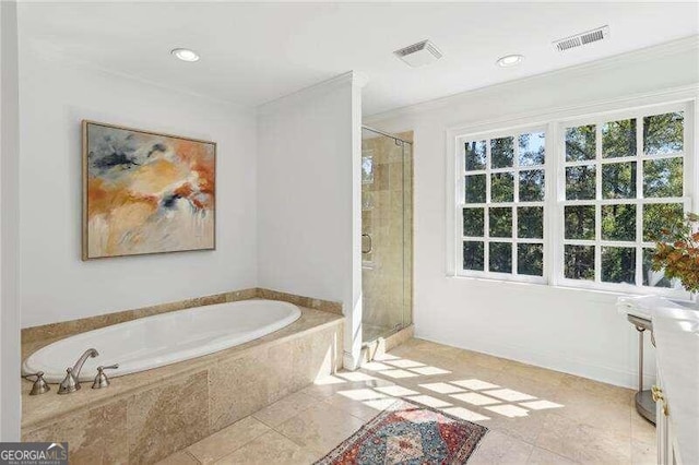 bathroom with tile patterned floors, crown molding, and independent shower and bath