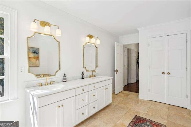 bathroom featuring vanity and ornamental molding