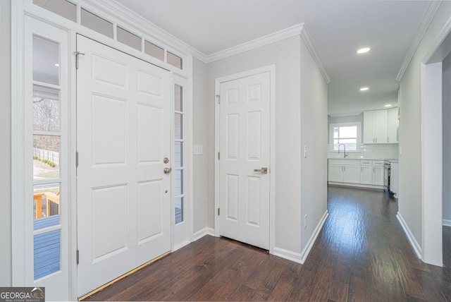 entryway featuring ornamental molding and dark wood-type flooring