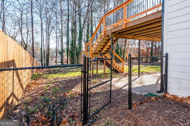 view of yard with a deck and a patio