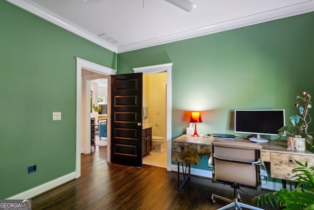 home office featuring dark wood-type flooring, ceiling fan, and ornamental molding