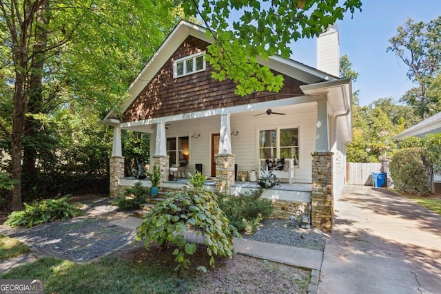 craftsman-style house with ceiling fan and covered porch