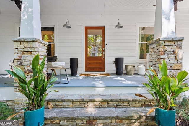 doorway to property featuring covered porch