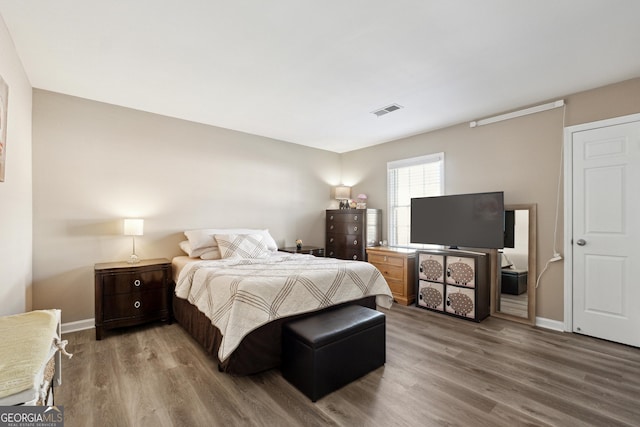 bedroom featuring hardwood / wood-style floors