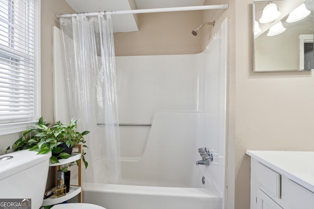 full bathroom with vanity, toilet, and shower / tub combo with curtain