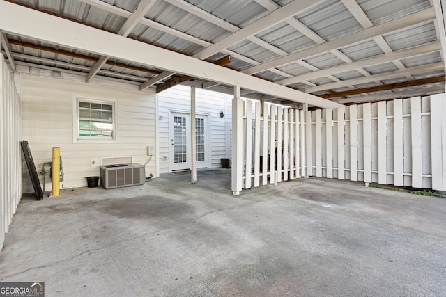 interior space featuring cooling unit and wood walls