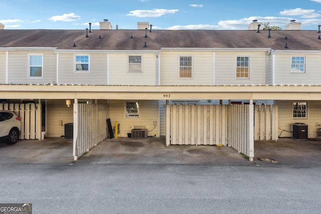 back of house featuring central AC