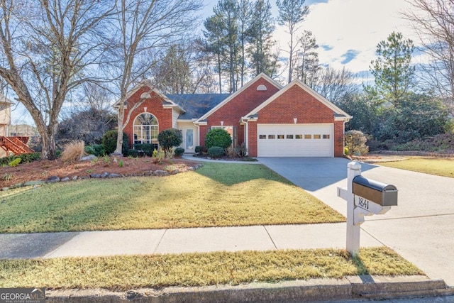 view of front of house featuring a garage and a front yard