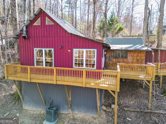 exterior space featuring a wooden deck and cooling unit