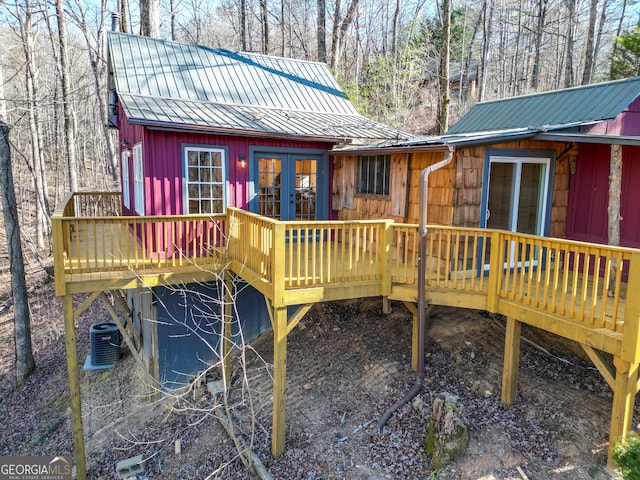 exterior space with central AC and french doors