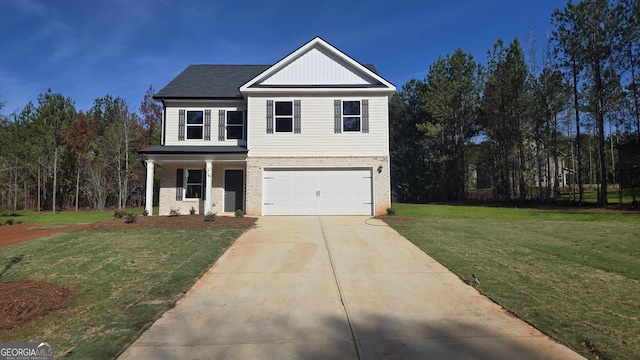 view of front of house featuring a front yard and a garage