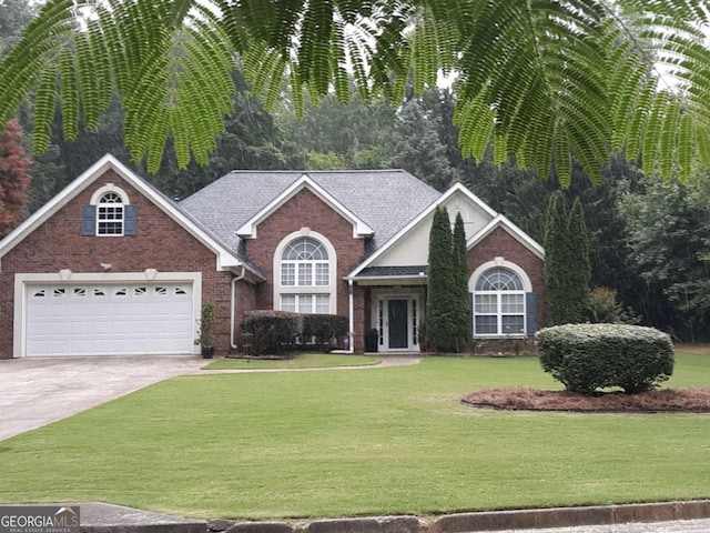 view of front facade with a front lawn and a garage