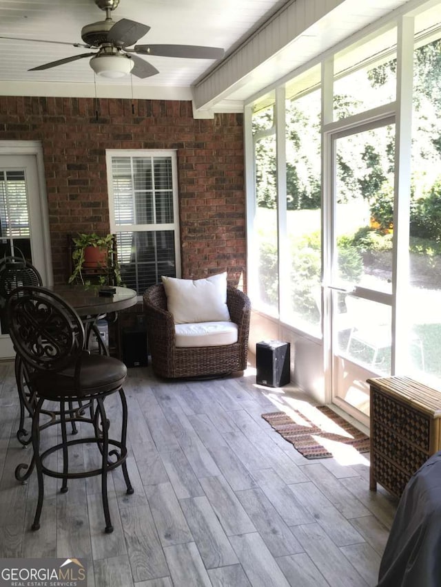 sunroom / solarium with ceiling fan