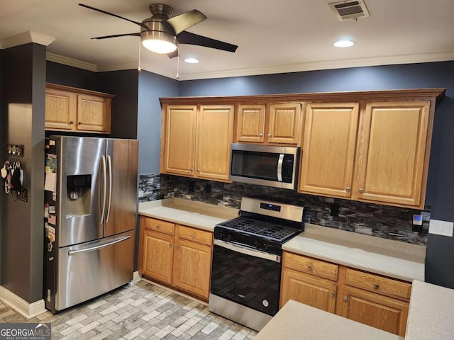 kitchen featuring stainless steel appliances, tasteful backsplash, crown molding, and ceiling fan