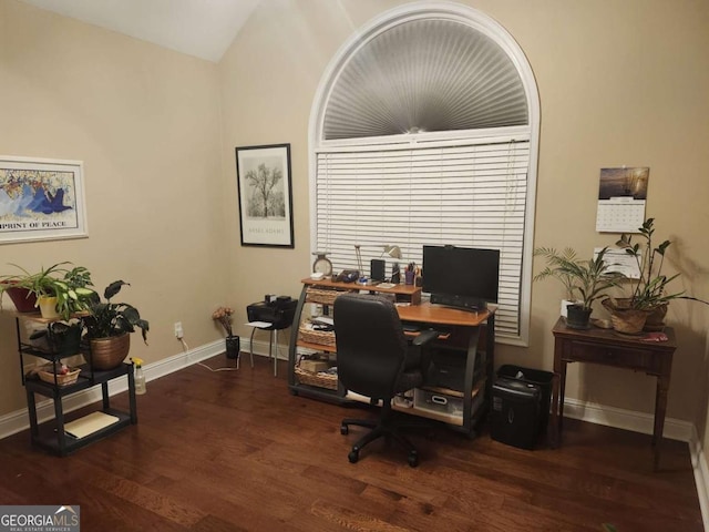 office with vaulted ceiling and dark wood-type flooring