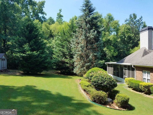 view of yard featuring a sunroom