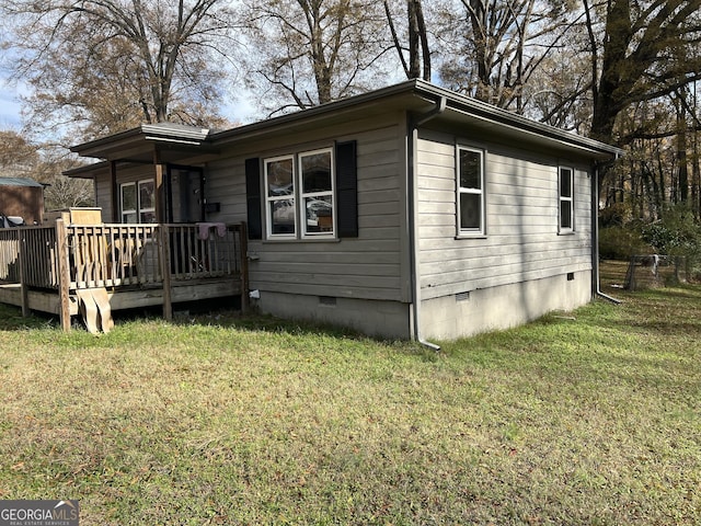 exterior space with a lawn and a deck