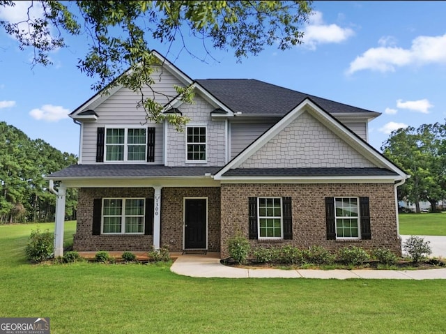 craftsman-style home featuring a front yard