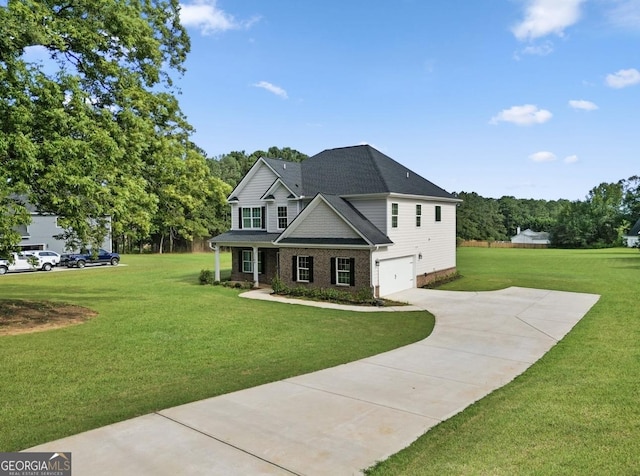 view of front of property featuring a garage and a front yard