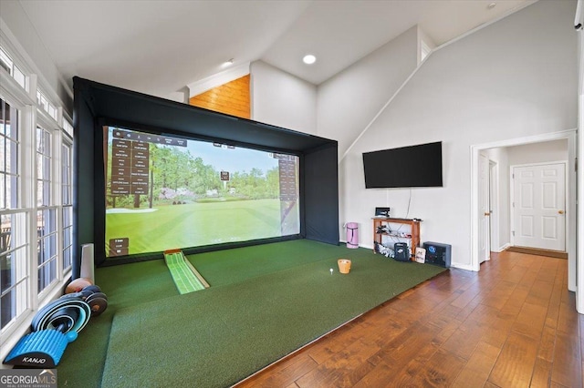 playroom featuring hardwood / wood-style floors, golf simulator, and lofted ceiling