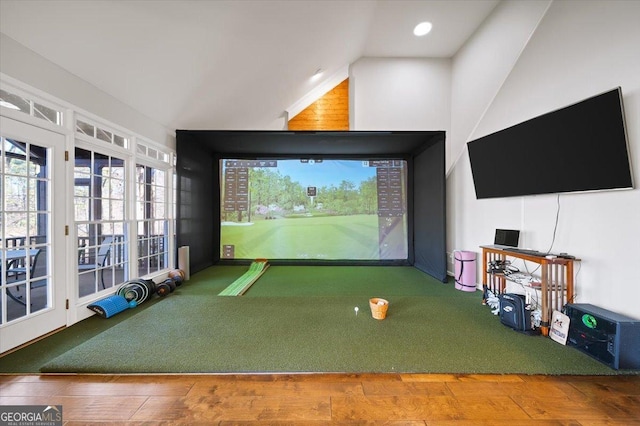 rec room with carpet floors, golf simulator, and lofted ceiling