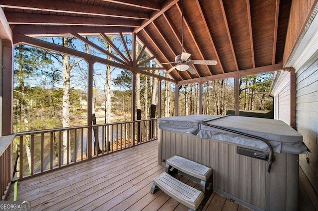 unfurnished sunroom with vaulted ceiling with beams, ceiling fan, wooden ceiling, and a hot tub