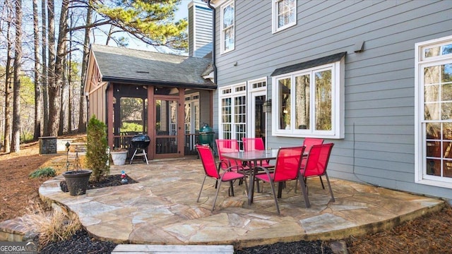 view of patio / terrace with a sunroom