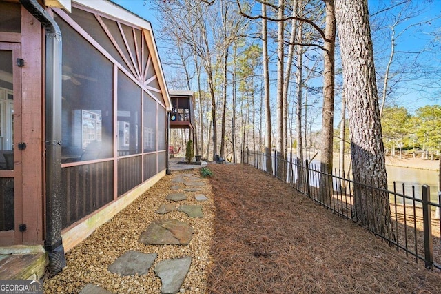 view of yard featuring a sunroom