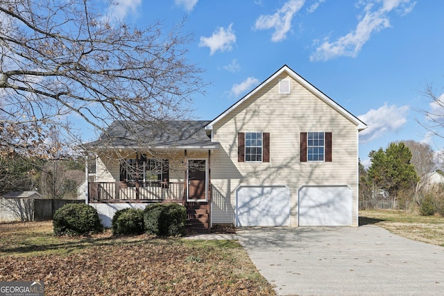 tri-level home with a porch and a garage