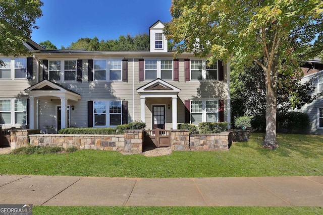 view of front facade with a front yard