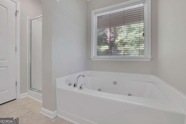 bathroom featuring tile patterned floors and plus walk in shower