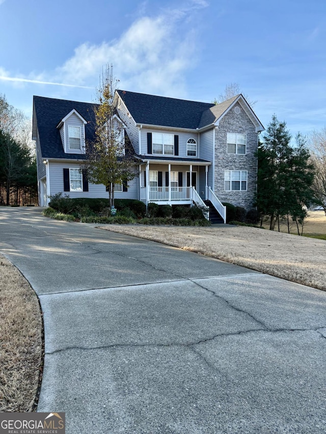 view of front of home with a porch and a garage