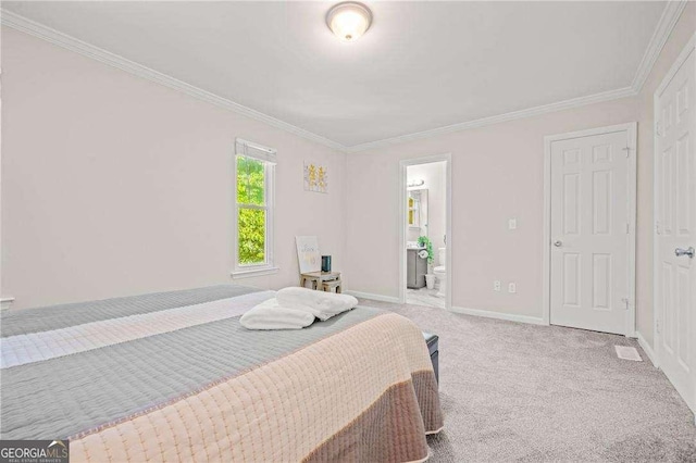 carpeted bedroom featuring connected bathroom and ornamental molding