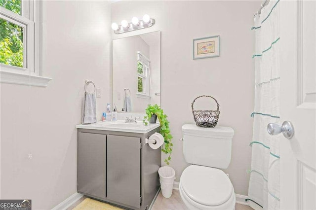 bathroom featuring vanity and toilet